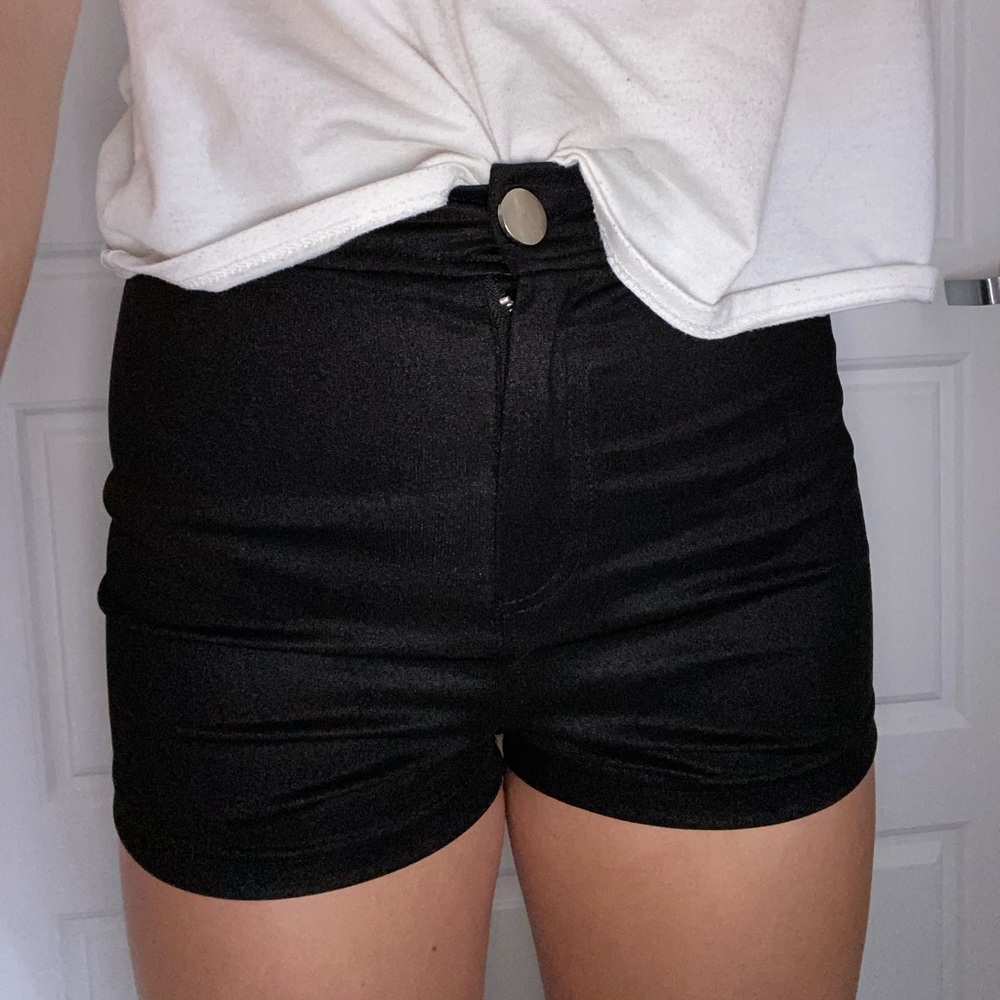Tight shiny black shorts